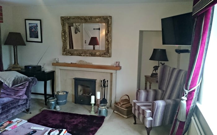 Relax in the sitting room at Evergreen Cottage