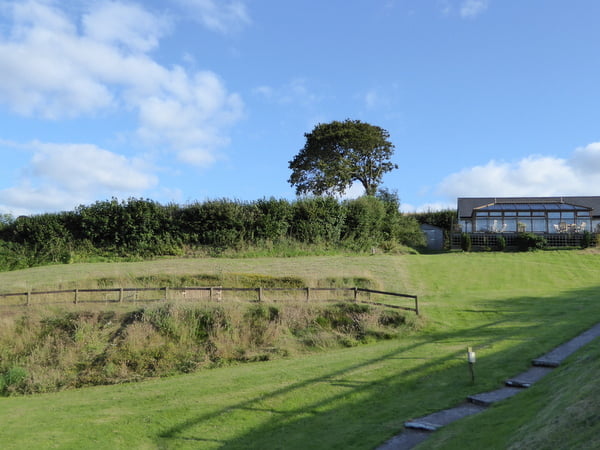 Spacious fenced grounds to play in at Robin Hill Farm Cottages