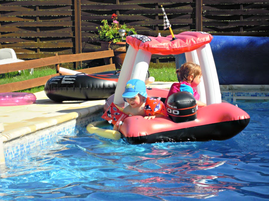 Playing in the toddler swimming pool at Grange Du Moulin